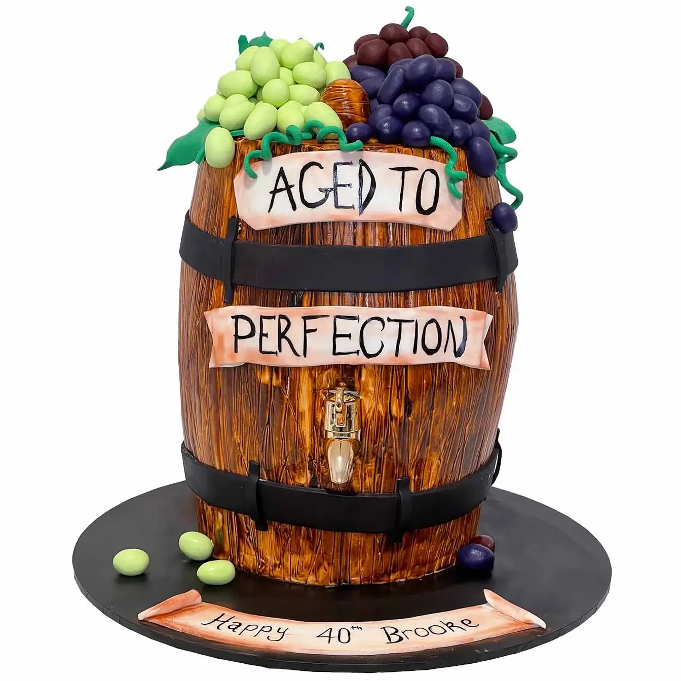 Wine Barrel Cake - A cake resembling a wine barrel with a functioning tap, a unique centerpiece for wine lovers and celebrations filled with elegance and flavour.