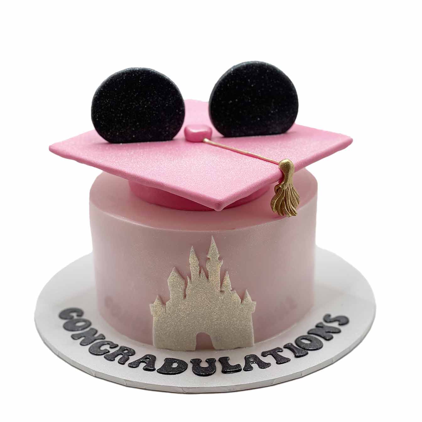 Graduation Mouse-Eared Castle Cake - A cake featuring the iconic castle on the front and mouse ears on the graduation hat, a perfect tribute to academic success and cherished memories.
