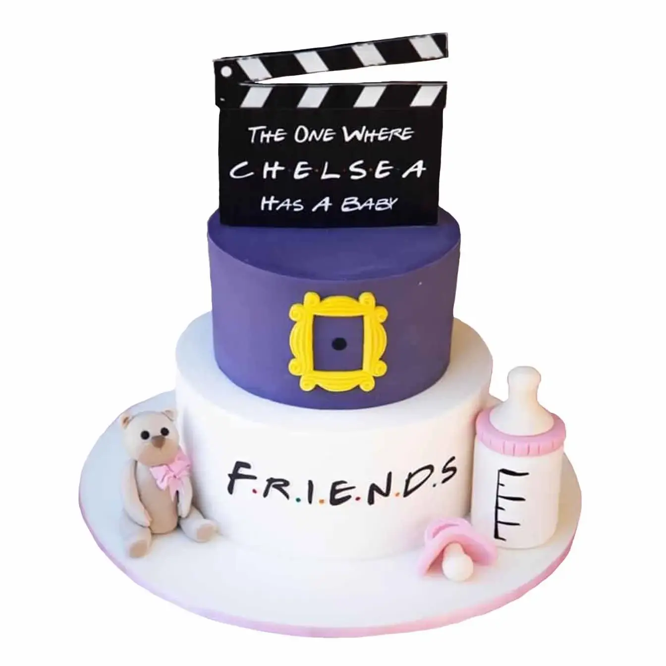 The One Where Chelsea Has a Baby" Baby Shower Cake - A two-tier cake featuring a molded teddy bear, baby bottle, and a "Friends" clapperboard, a heartwarming centerpiece for celebrating friendship and a new baby.
