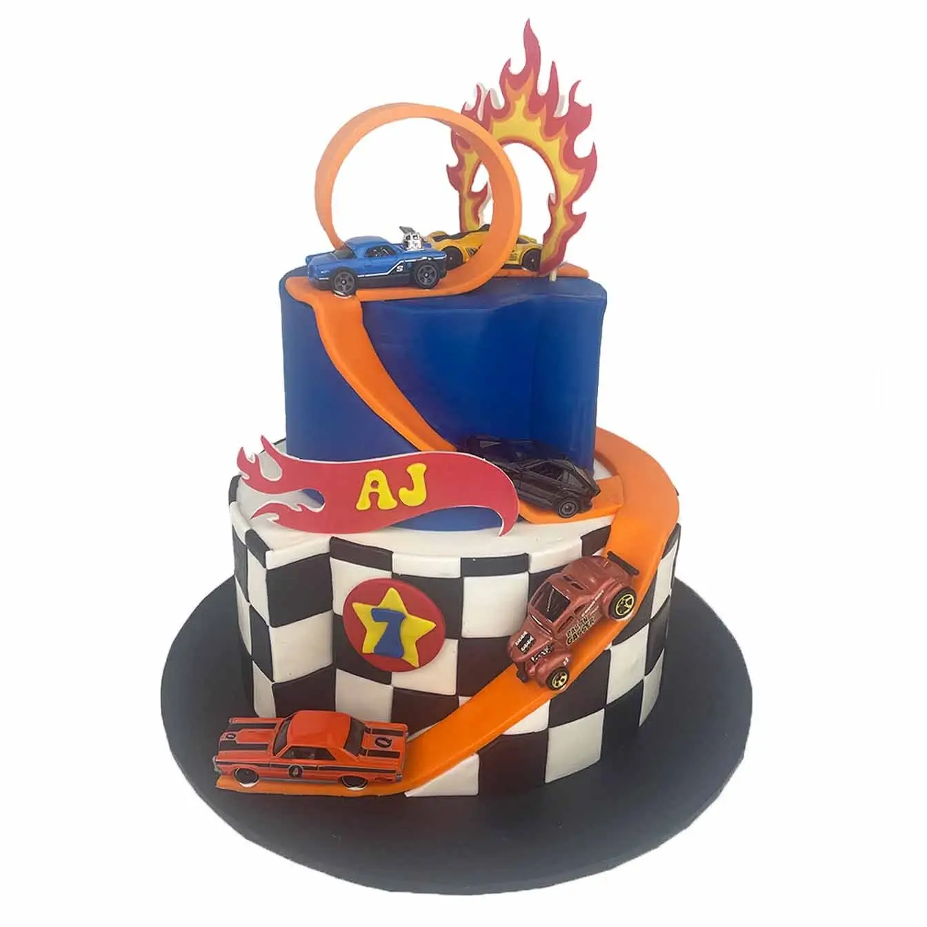 Hot Wheels Adventure Cake - A two-tier cake with a thrilling loop, carved race track, black-and-white squares, and a fiery loop, a show-stopping centerpiece for birthdays and racing-themed celebrations.
