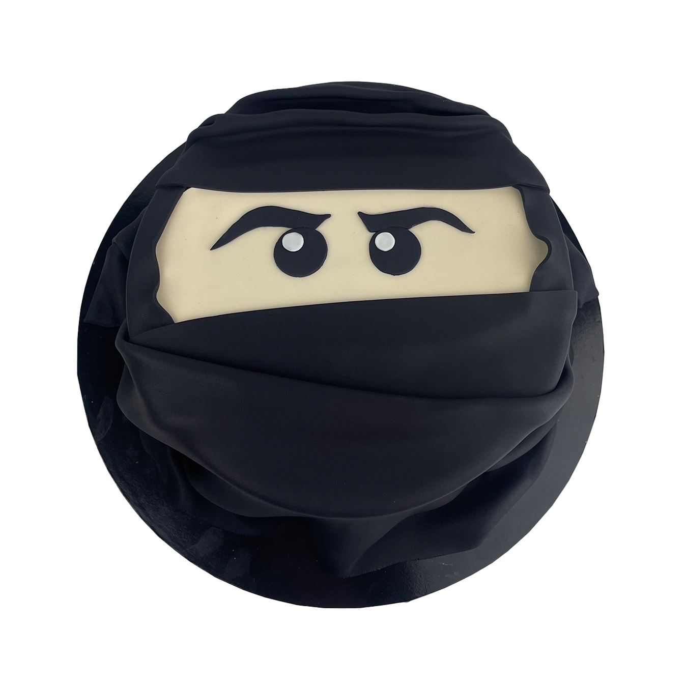 Ninja Adventure Face Cake - A thrilling Ninjago-inspired cake with cutout face design and black ninja mask, perfect for martial arts enthusiasts.