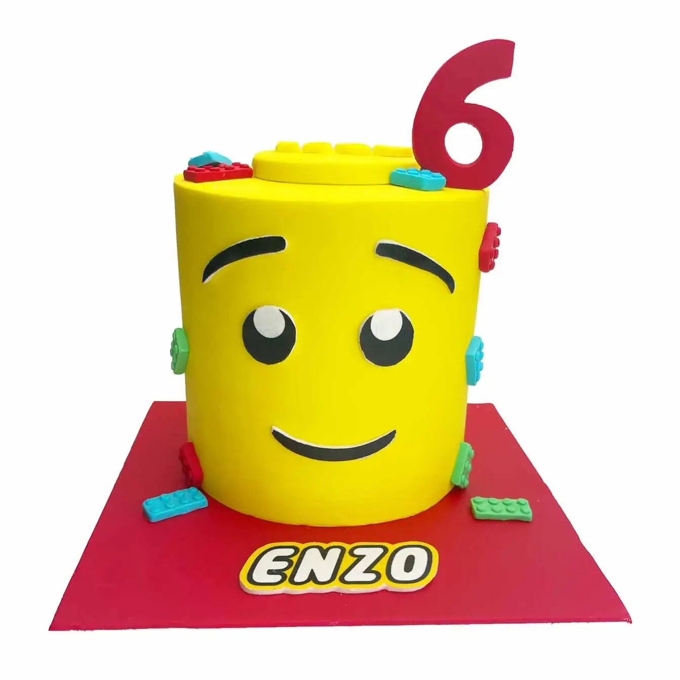 Build-A-Block Lego Head Cake - A cheerful boy Lego head with cascading Lego bricks, a playful centerpiece for Lego enthusiasts.