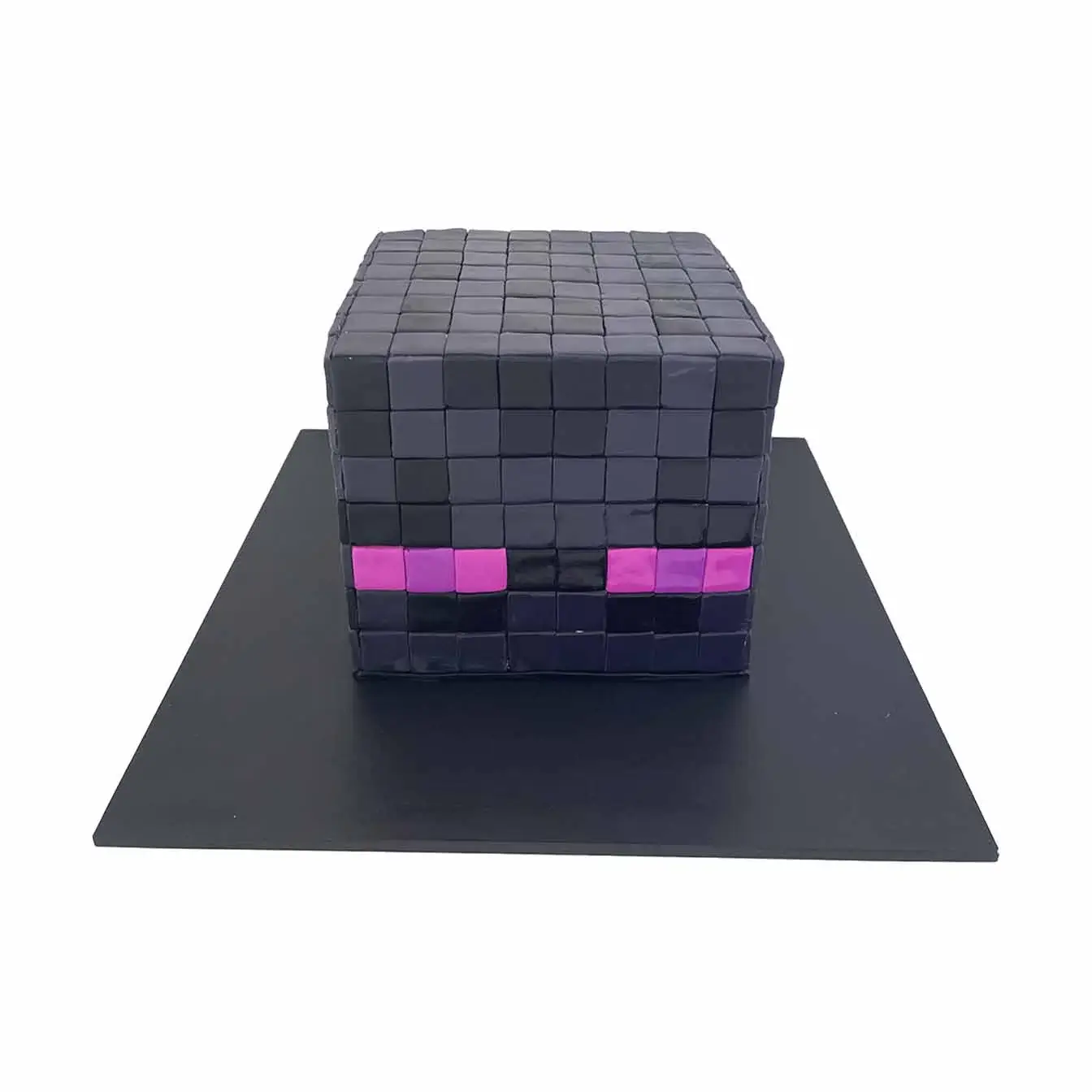 Minecraft Enderman Adventure Cake - A cake inspired by the Enderman character from Minecraft, with dark color and purple eyes, a captivating centerpiece for gamers and Minecraft enthusiasts.