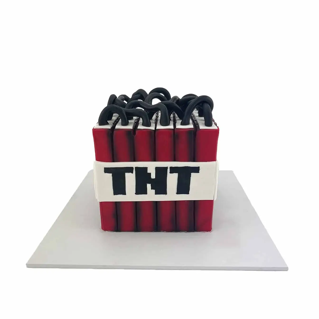 Minecraft TNT Blast Cake - A cake inspired by the TNT block from Minecraft, with vibrant red design, a perfect centerpiece for gamers and Minecraft enthusiasts.