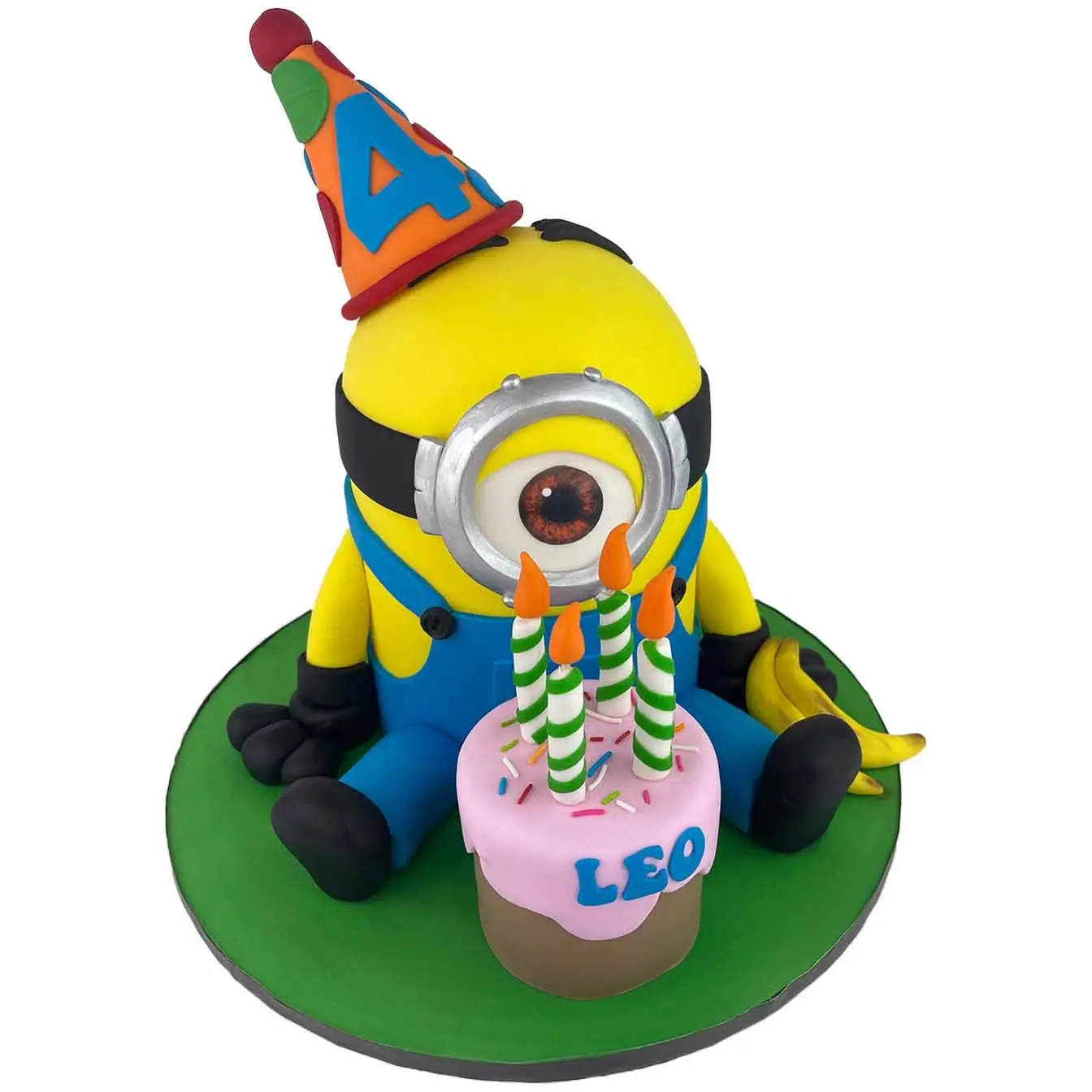 Minion Party Extravaganza Cake - A 3D Minion wearing a party hat, a fun and flavorful centerpiece for birthdays and Minion-themed celebrations.
