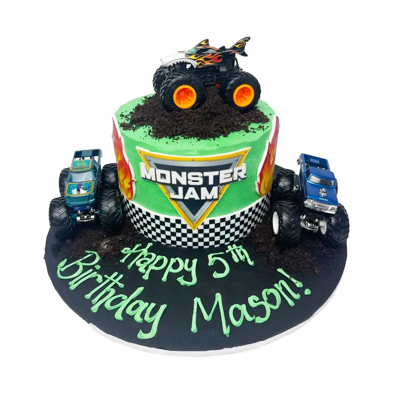 Monster Jam Cake - A cake with three Hot Wheels monster trucks on a bed of Oreo dirt, a dynamic centerpiece for birthdays and celebrations filled with high-octane adventure.