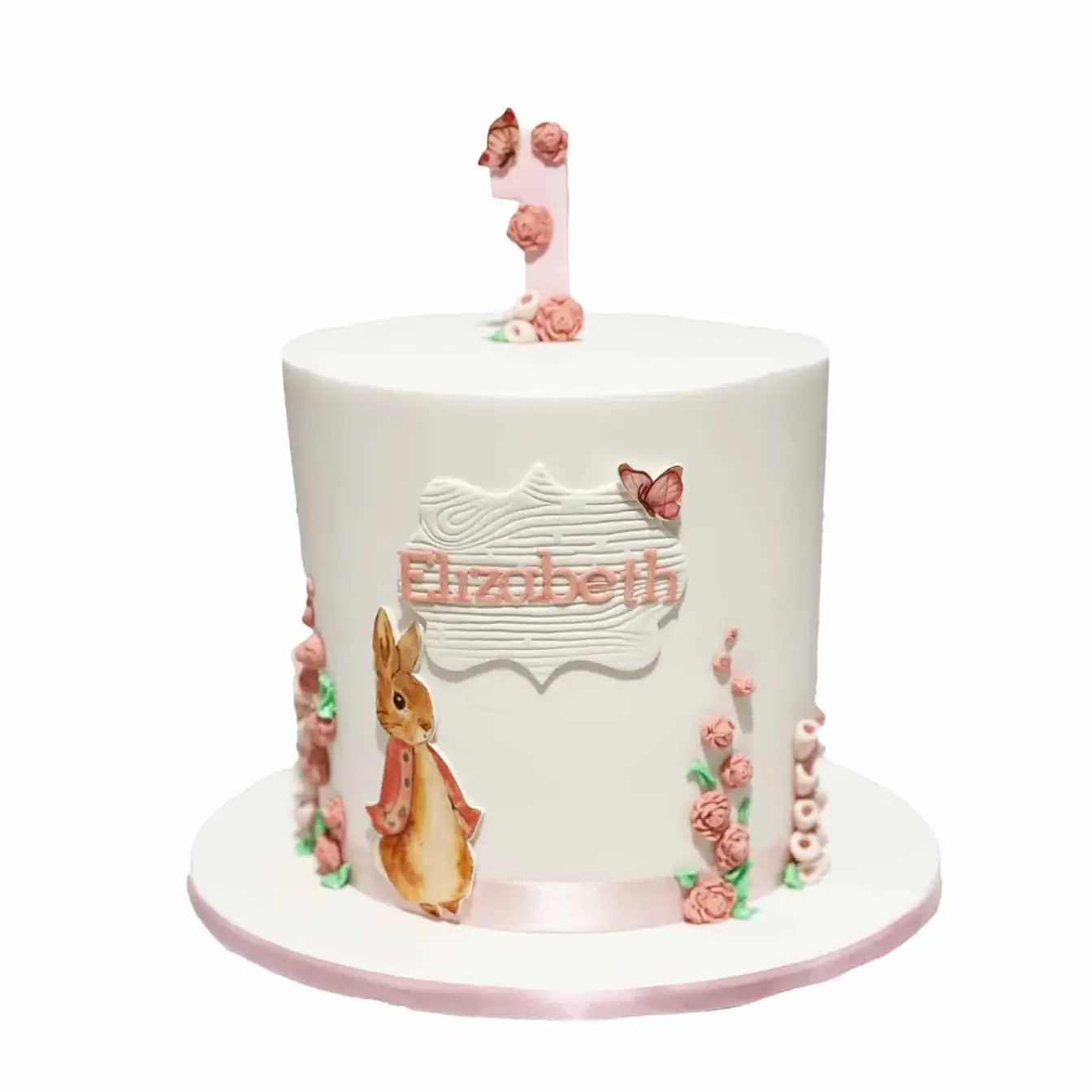 Peter Rabbit's Garden Delight Cake - A pink-themed cake with molded mini roses, a sweet and enchanting centerpiece for birthdays, baby showers, and fans of the classic tale.