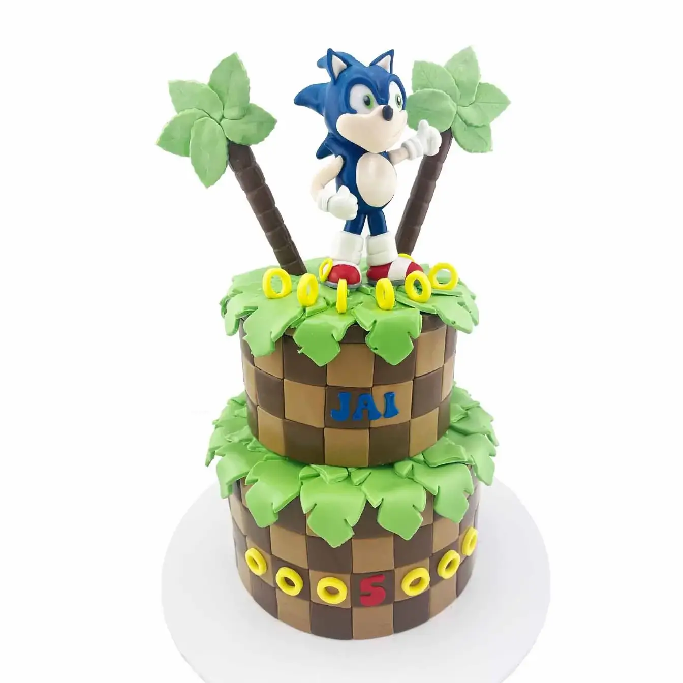 Sonic Adventure Cake - A two-tier cake with molded Sonic, brown checkers, and two palm trees, a thrilling centerpiece for gamers and fans of the blue blur.