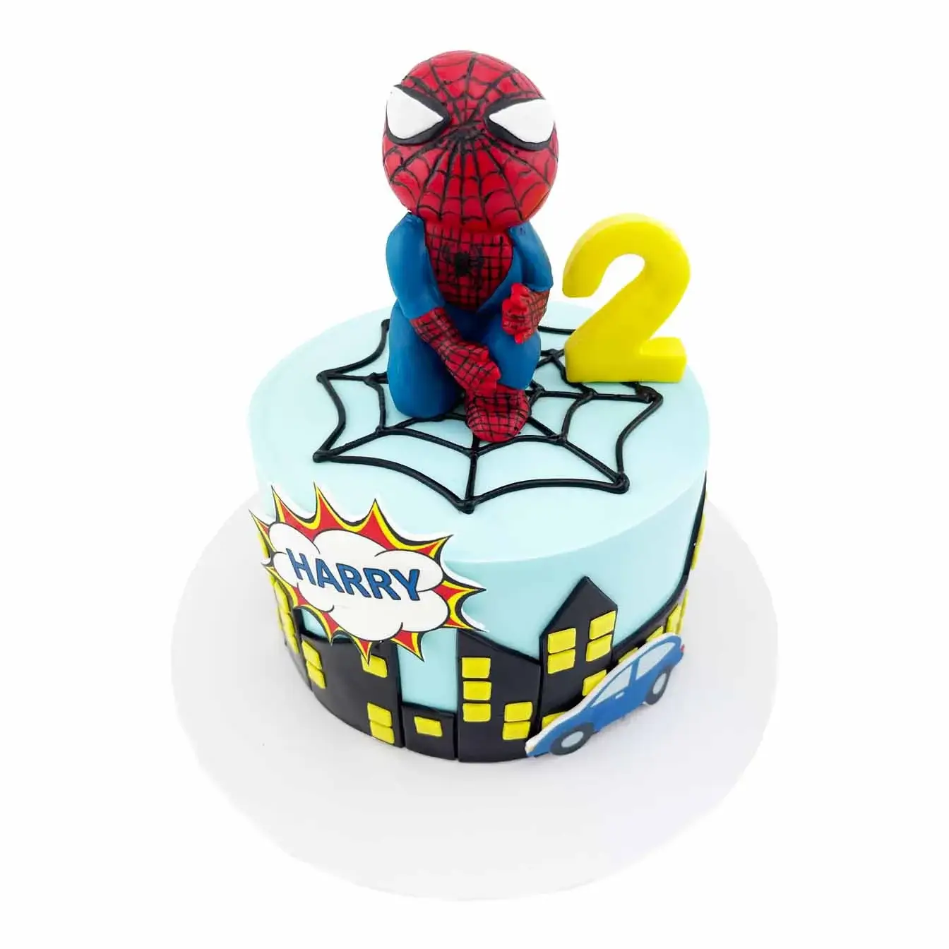 Our Spiderman cake with city skyline design features a smooth blue fondant cake with a black city skyline made of fondant. Topped with a cartoon Spiderman figurine, it's perfect for any Spiderman fan's celebration!
