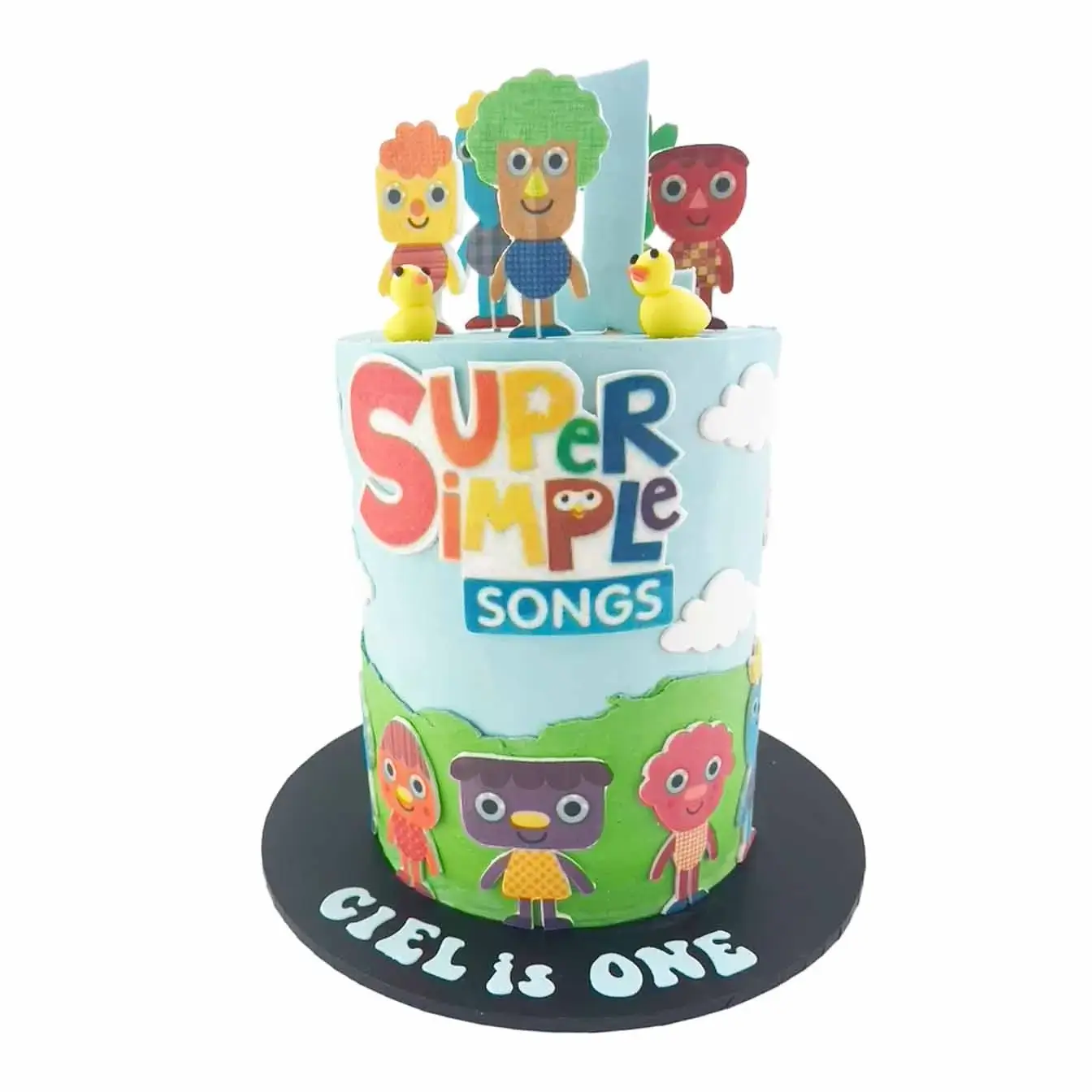 Super Simple Songs Celebration Cake - A joyful blue background with green hills, adorned with beloved characters, a delightful centerpiece for birthdays and children's celebrations.