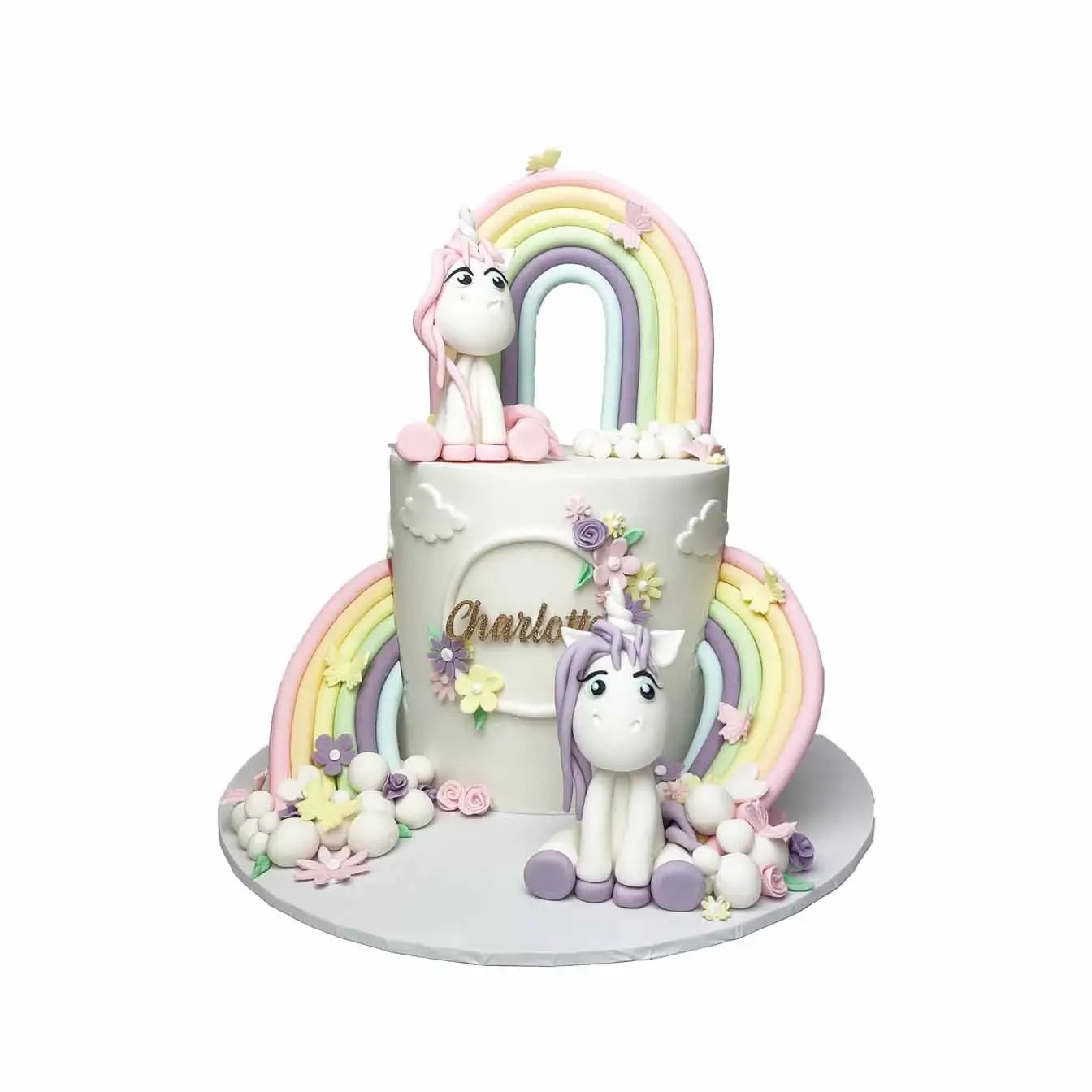 Enchanting Unicorn Wonderland Cake - A magical cake with rainbow molded slides, fluffy white clouds, and three molded unicorns, a perfect centerpiece for birthdays and celebrations of enchantment.