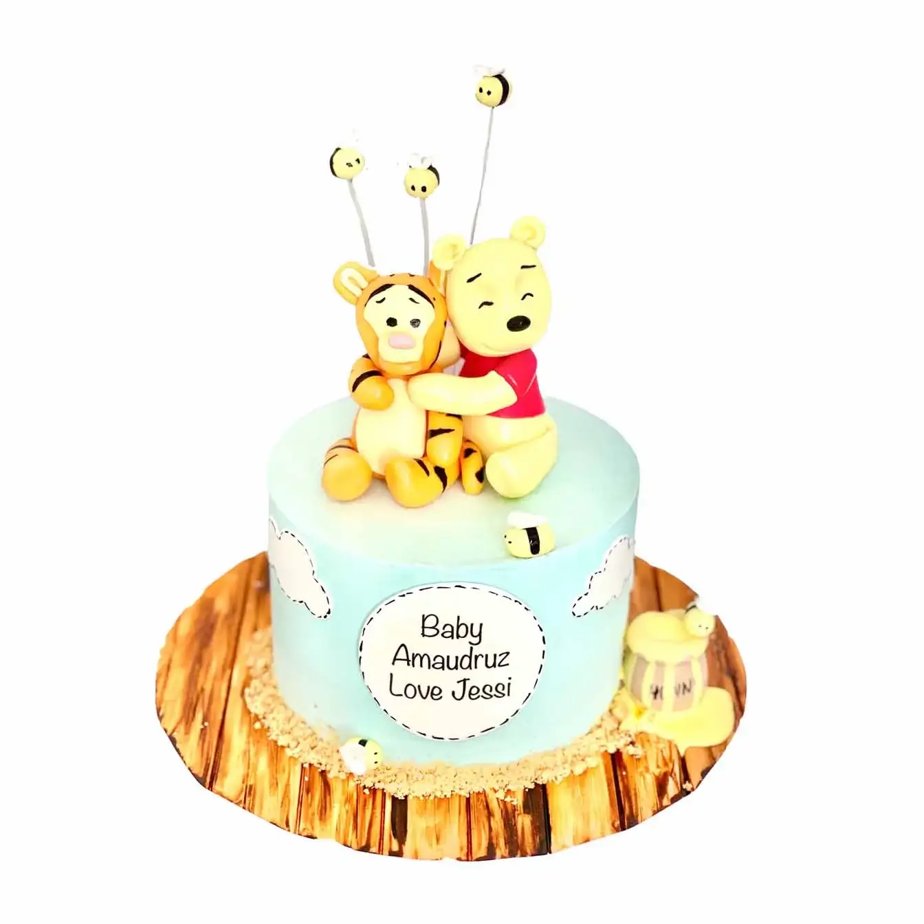 Winnie the Pooh's Sweet Arrival Cake - A blue-iced cake with bees, Winnie the Pooh, Tigger, and honey pots, a delightful centerpiece for a Winnie the Pooh-themed baby shower.